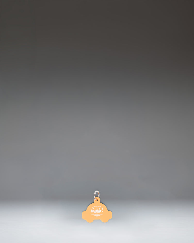 Herschel Taxi Bag Charm in Taxi yellow, resembling a classic New York City taxicab.