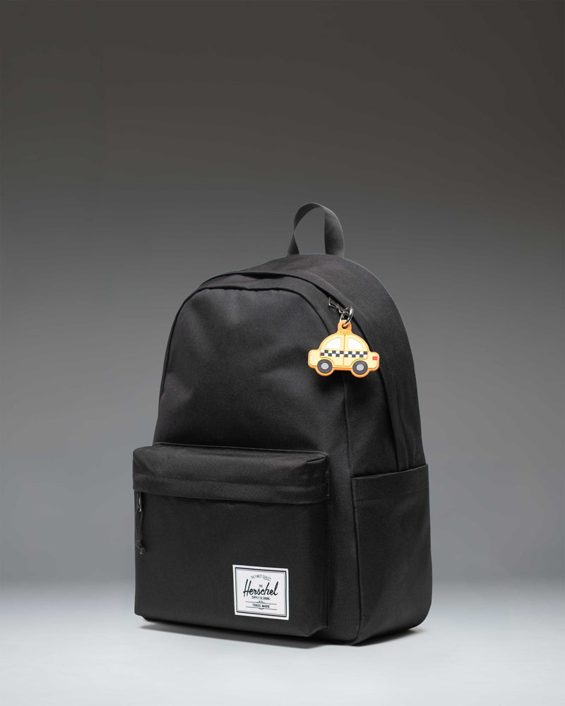Yellow New York City taxi cab plush bag charm with a black clip, part of the Herschel Supply Co. collection.