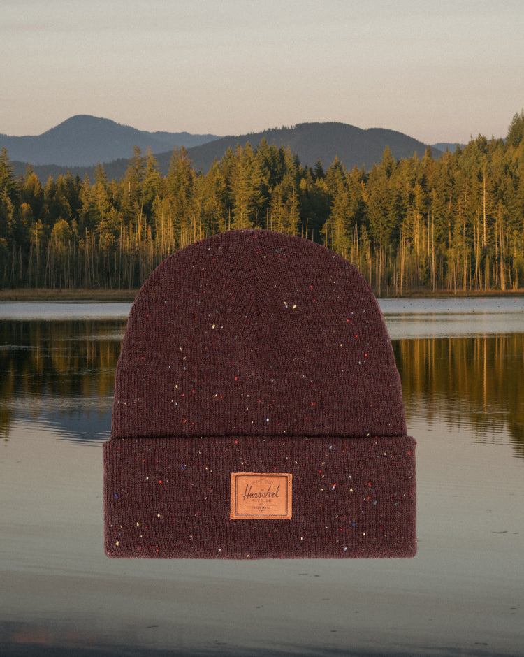Herschel Supply Co. Classic XL 30L backpack in Bitter Chocolate brown, featuring a front zippered pocket and a classic brand logo patch.