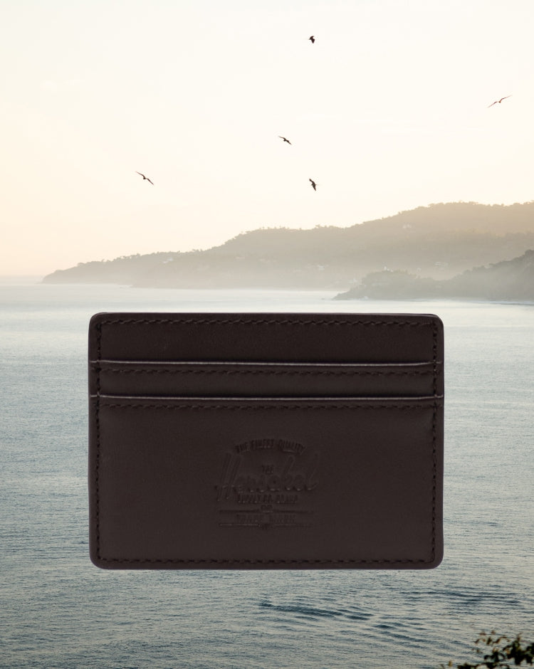 Herschel Supply Co. Charlie Cardholder Leather in brown, featuring a slim design with multiple card slots and a classic woven label.