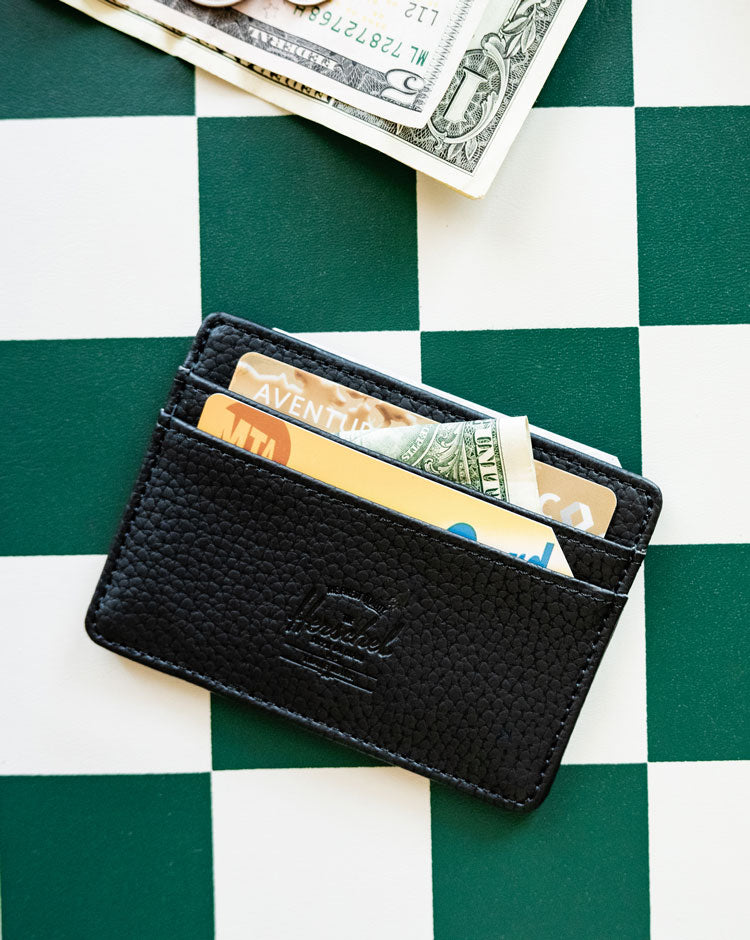 Herschel Supply Co. Charlie Cardholder in sleek black vegan leather, featuring multiple card slots and a slim, compact design.