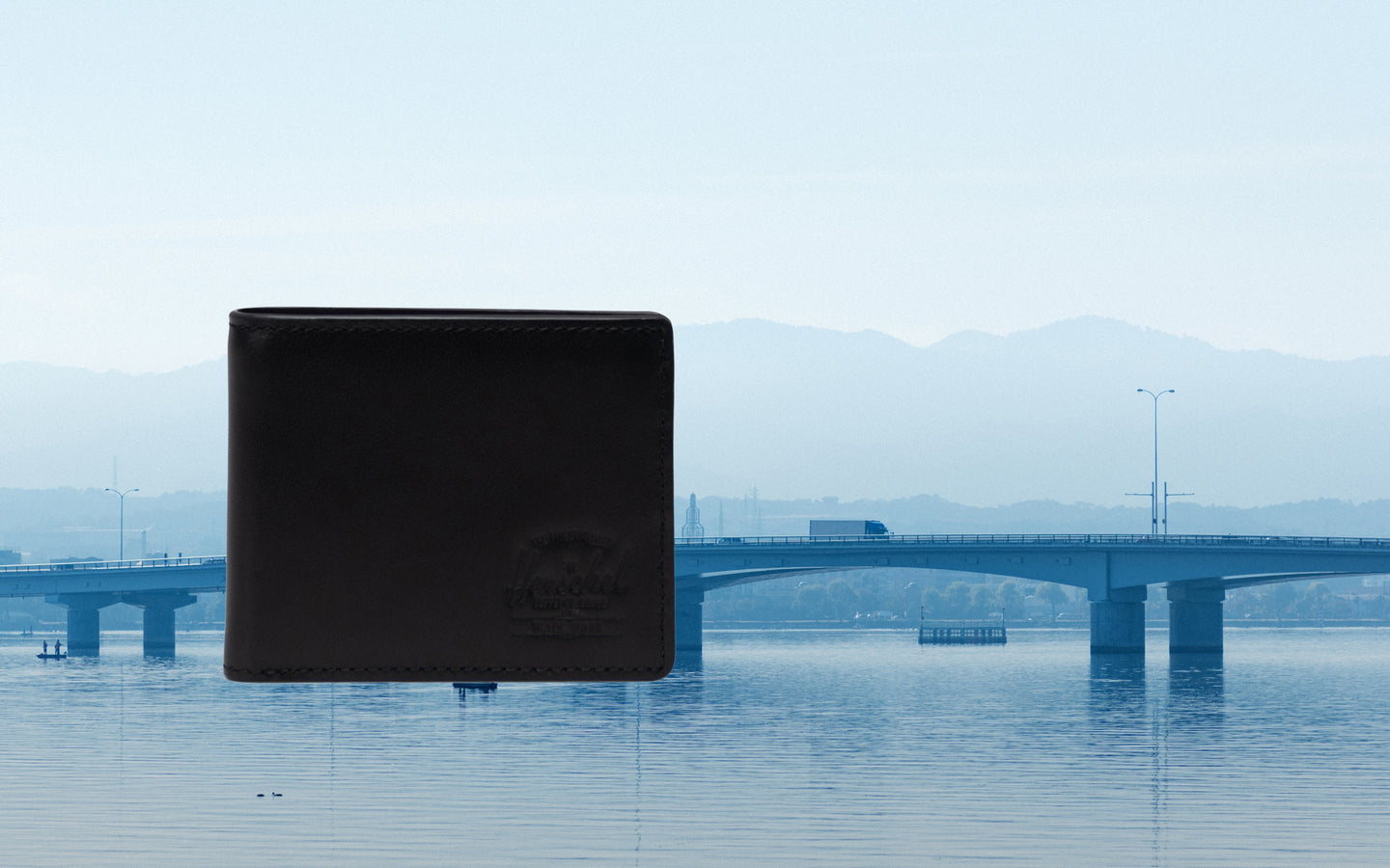 Herschel Supply Co. Hank Wallet Leather in Black, a classic bi-fold wallet showcasing its sleek design and durable leather construction.