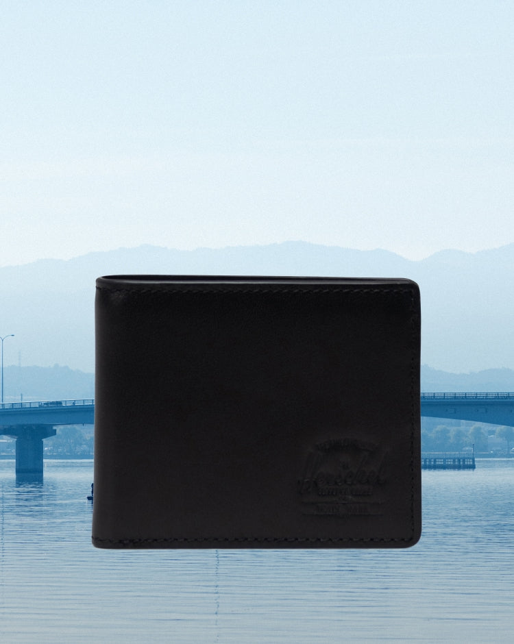 Classic Herschel Supply Co. Hank bifold wallet in premium black leather, displaying a sleek and minimalist design for everyday use.