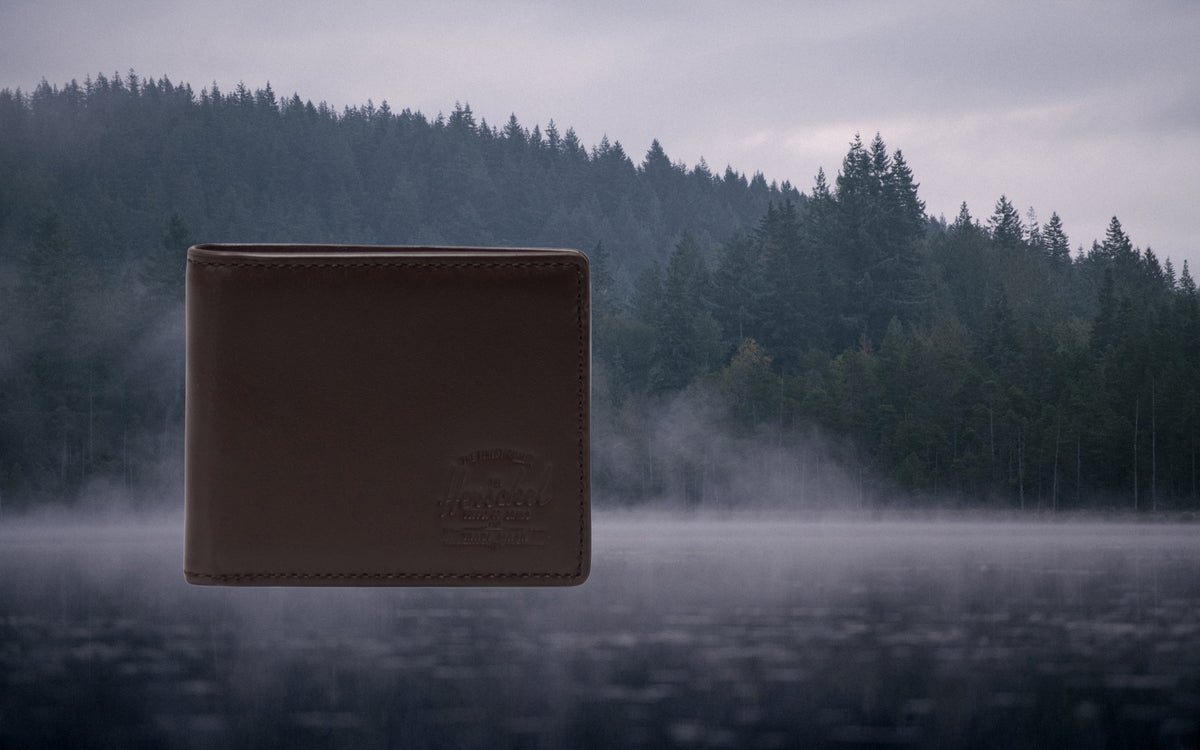 Herschel Supply Co. Hank bifold wallet in brown leather, showcasing a classic and durable design for everyday use.