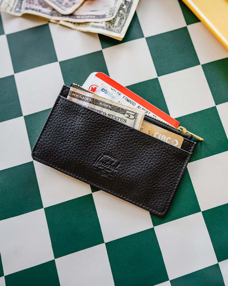 Herschel Supply Co. Oscar Large Cardholder Vegan Leather in black, showing the front card slots and minimalist design.