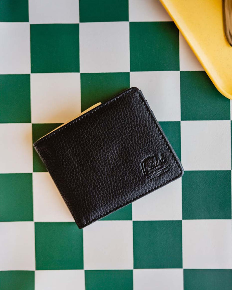 Herschel Supply Co. Roy Wallet Vegan Leather in classic black, showing a clean, bi-fold design.