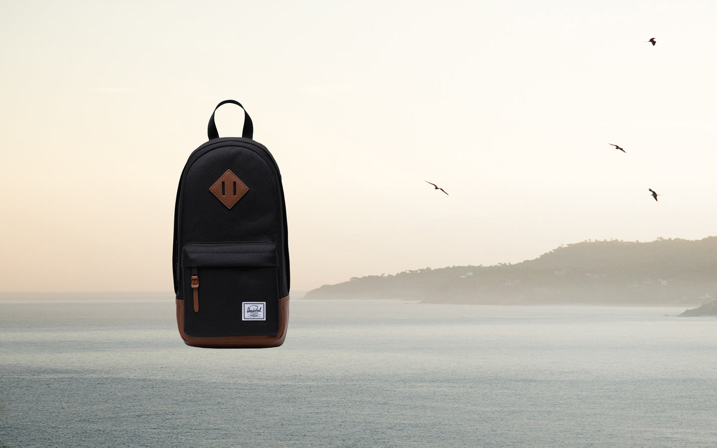 Herschel Heritage Shoulder Bag in Black/Tan shown from a desktop hero view.