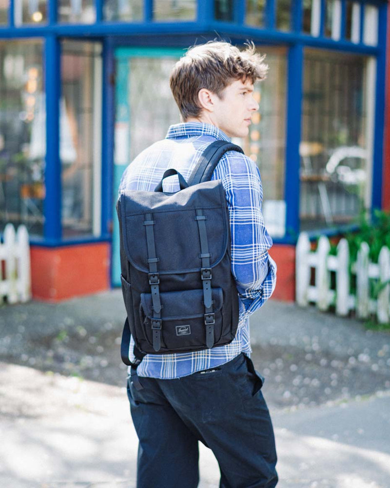 Herschel Little America Mid Backpack in Black Tonal, featuring dual straps, a front pocket, and classic design.