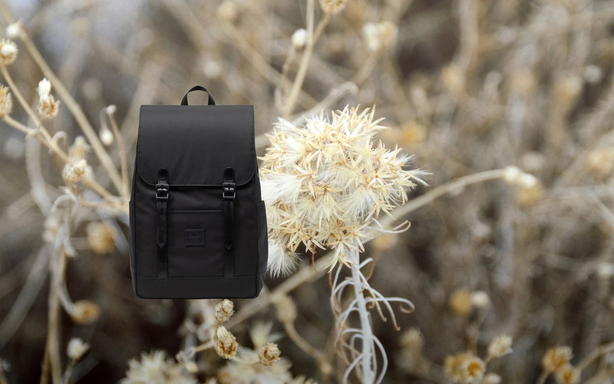 Black Herschel Retreat Small Backpack displayed from the front against a neutral background.