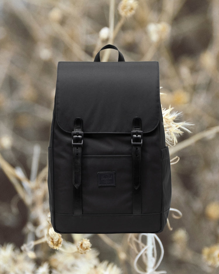Black Herschel Retreat Small Backpack displayed on a mobile screen format.