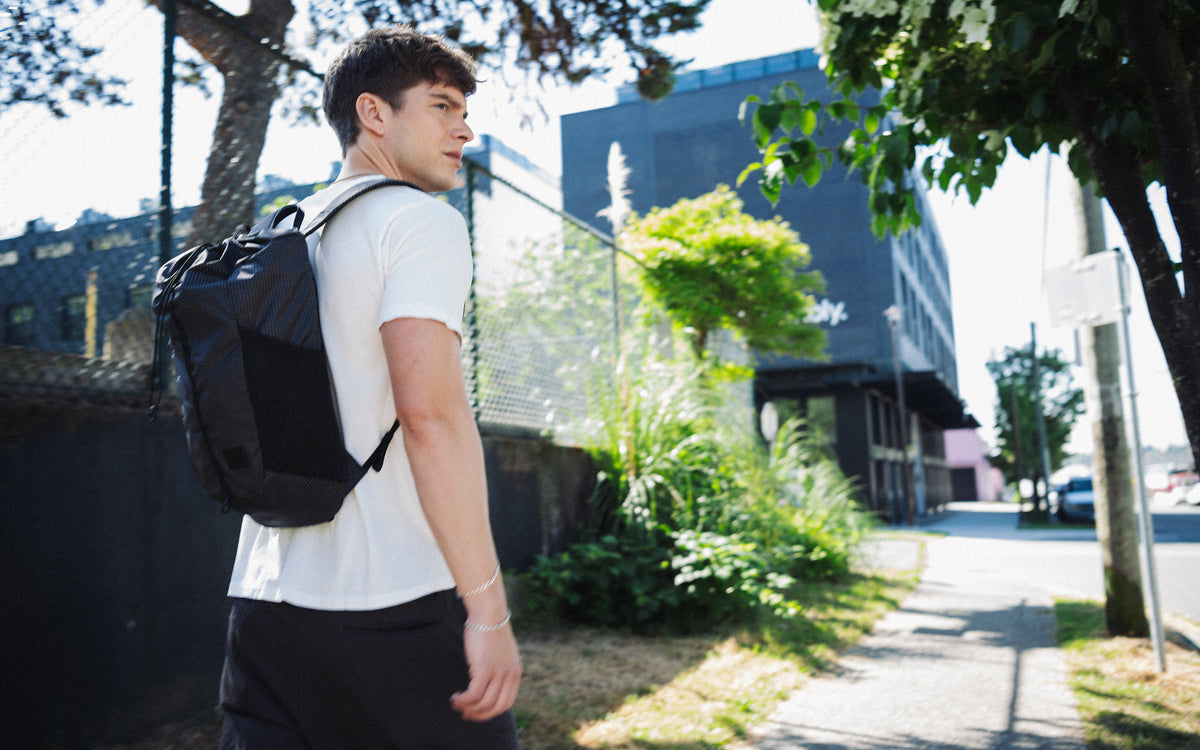Herschel Supply Co. Ultralight Cinch Daypack 14 L in black, a lightweight and versatile backpack for everyday use.