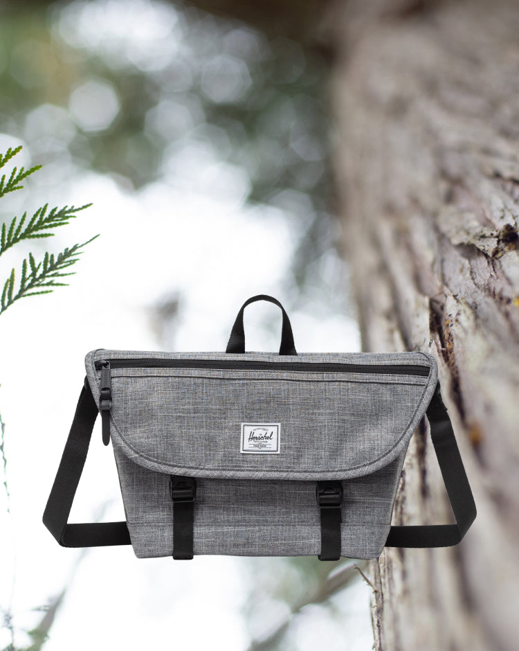 Herschel Supply Co. Cove Small Messenger bag in Raven Crosshatch grey.