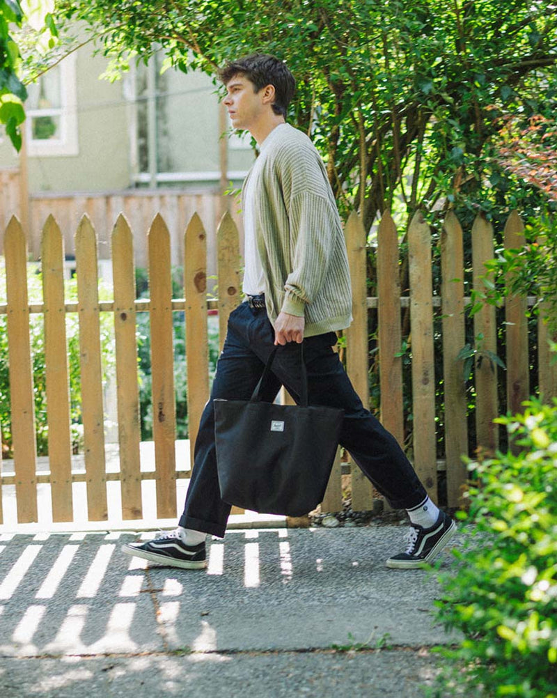 Herschel Supply Co. Classic Tote bag in black featuring a minimalist design with top-carrying handles.