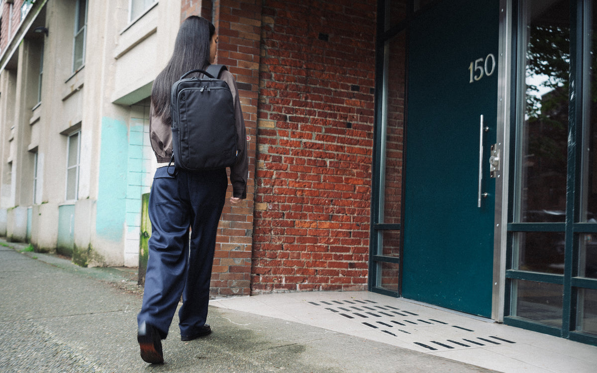 Herschel Supply Co. Kaslo Daypack Tech Cordura in black, shown from the front against a clean background, highlighting its durable fabric.