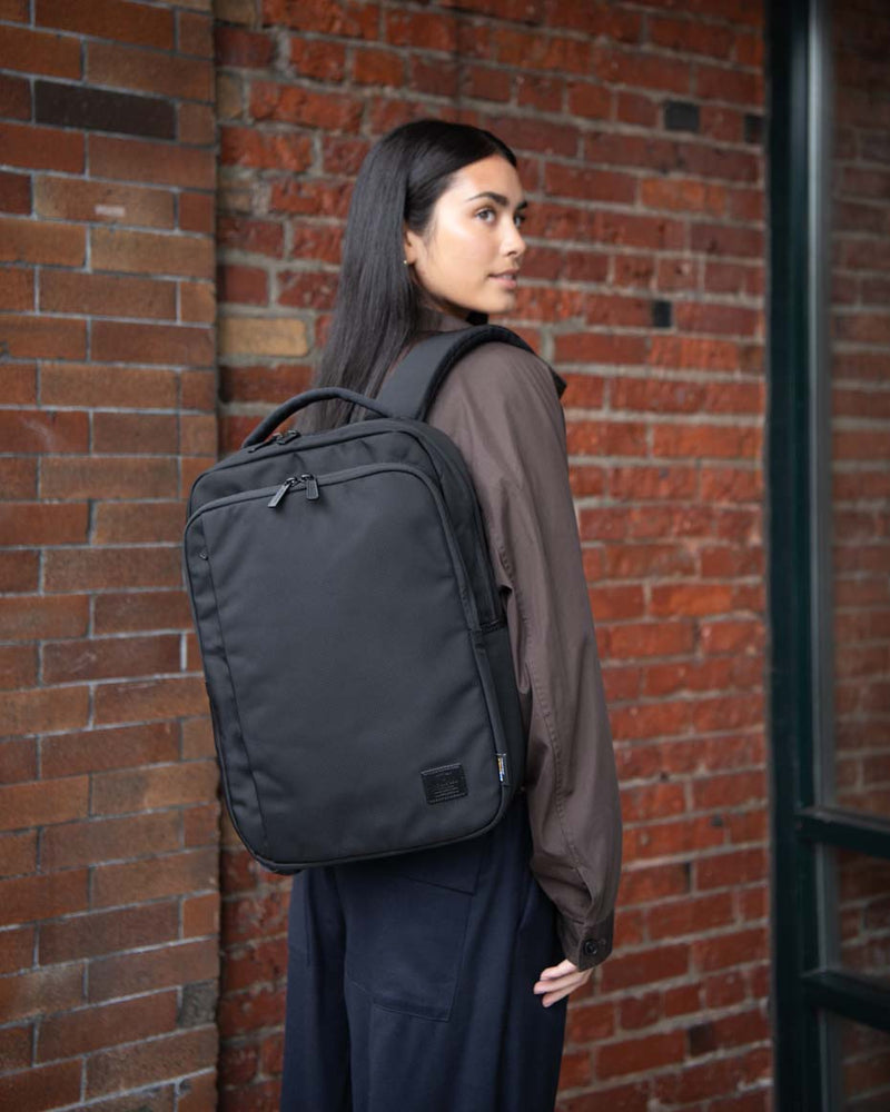 Herschel Supply Co. Kaslo Daypack Tech Cordura in black, shown from the front as a hero shot for mobile.