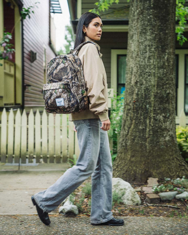 Herschel Supply Co. Classic XL Backpack in Realtree APX Camo pattern, showing the front view.