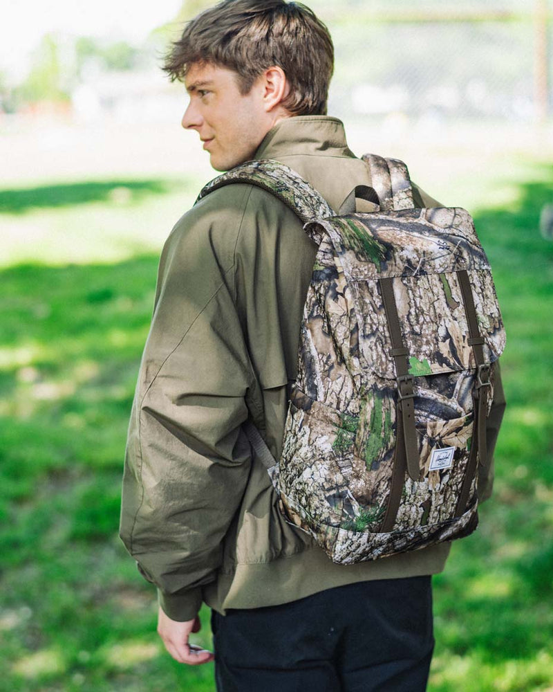 Herschel Supply Co. Retreat Backpack in Realtree APX Camo pattern.