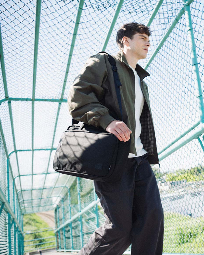 Herschel Supply Co. Gibson Messenger Tech Cordura bag in black, displaying a clean, professional design suitable for daily commuting.