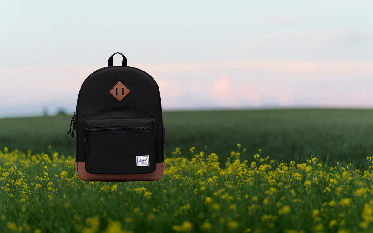 Herschel Heritage Kids Backpack in Black with Saddle Brown accents.