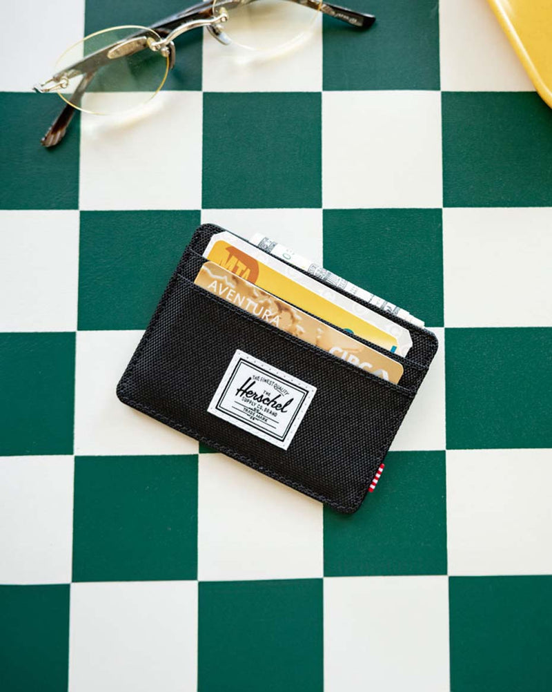 Herschel Supply Co. Charlie Cardholder in classic black, showcasing its sleek, minimalist design and multiple card slots.