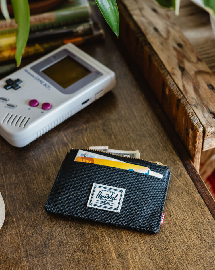 Herschel Supply Co. Oscar Cardholder in black, showing the clean design and multiple slots for cards.