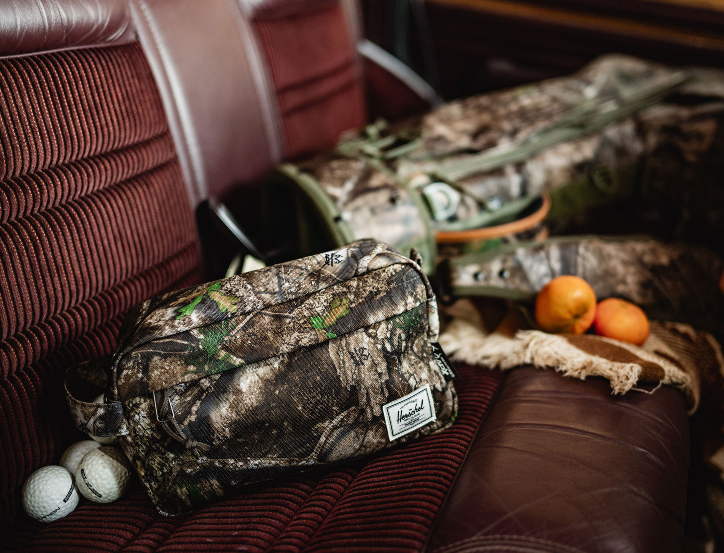 Herschel Supply Co. Realtree Chapter Travel Kit in Realtree APX Camo pattern displayed against a clean background.