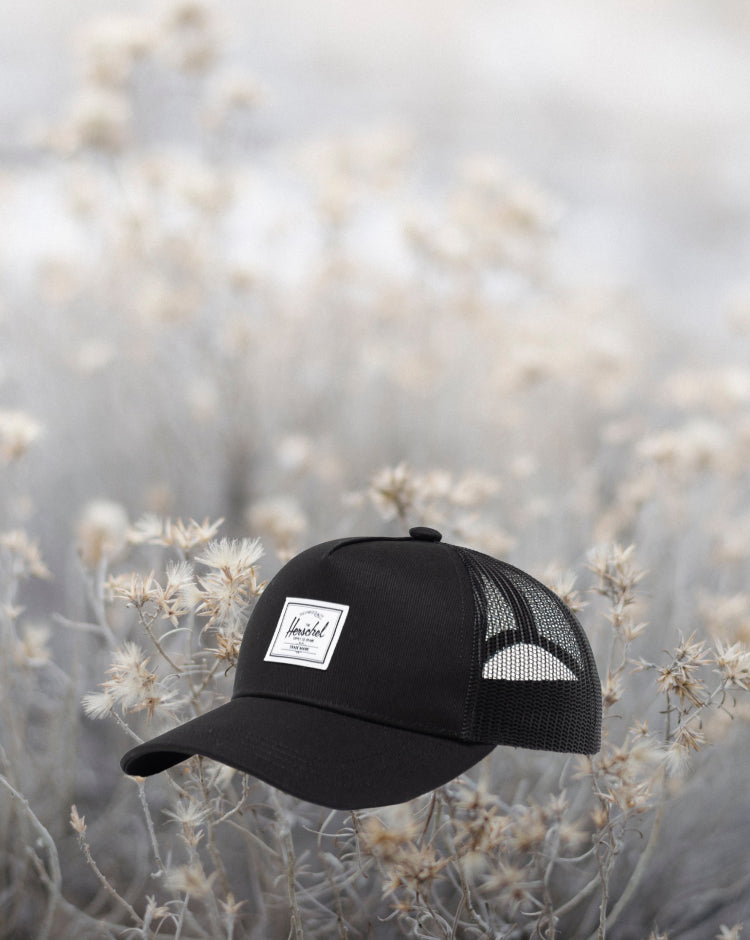 Herschel Supply Co. Whaler Cotton Mesh Kids Cap in black, featuring a structured crown and a mesh back panel.