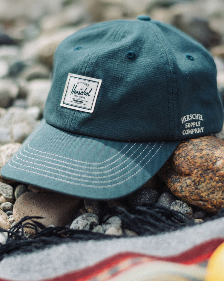 Herschel Supply Co. Sylas Premium Cap in Green Gables with vintage white stitching, displayed from the front.