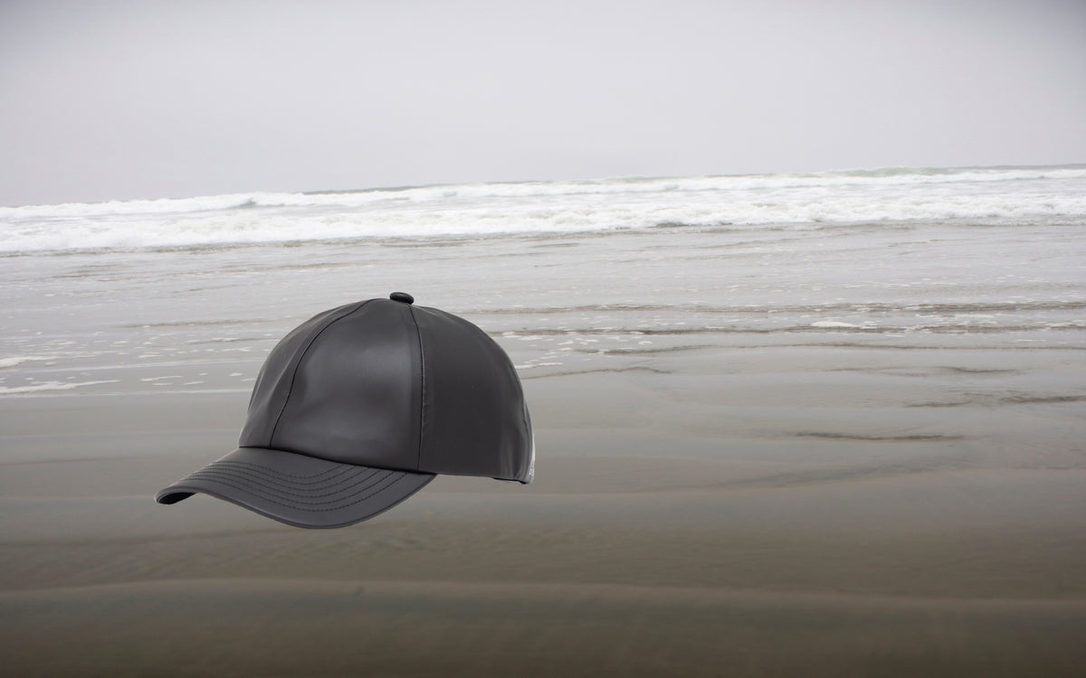 Herschel Supply Co. Sylas Rain Cap in black, shown from the front against a neutral background.