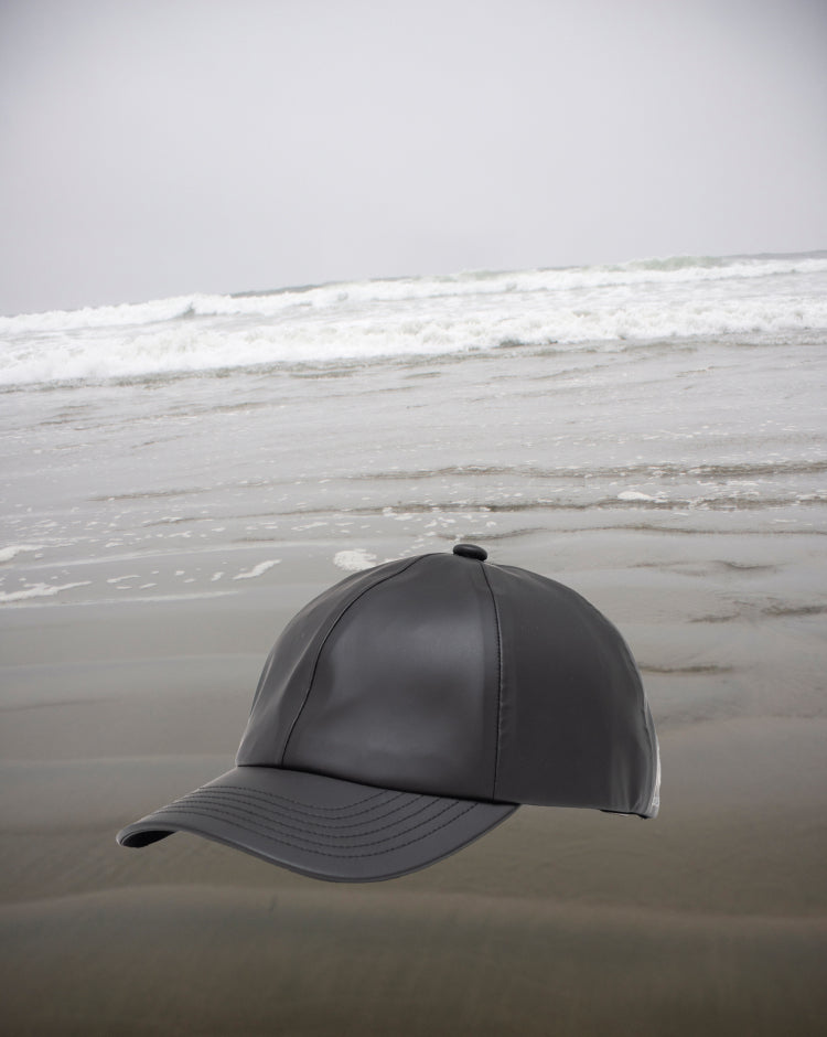 Black Herschel Supply Co. Sylas Rain Cap, a classic adjustable strapback baseball hat designed for rainy weather.