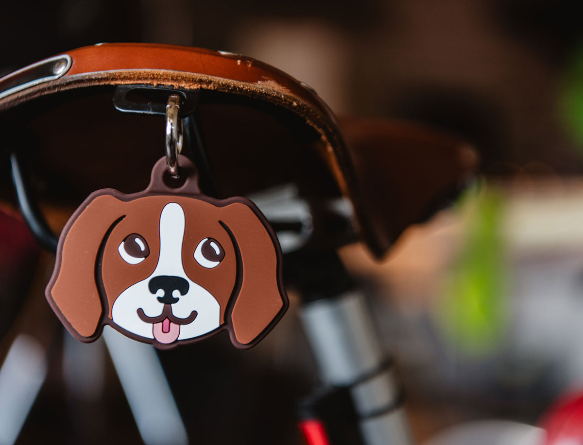 Herschel Supply Co. playful brown hound dog bag charm made of silicone with a metal keyring attachment.