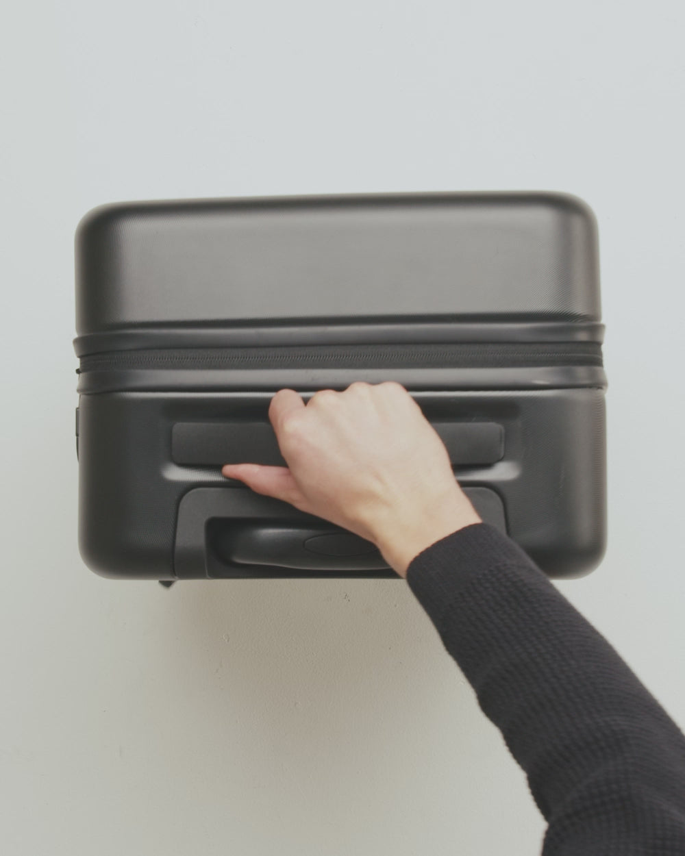 Herschel Supply Co. Heritage Hardshell Large Carry On luggage displayed in multiple colors to showcase the different color options.