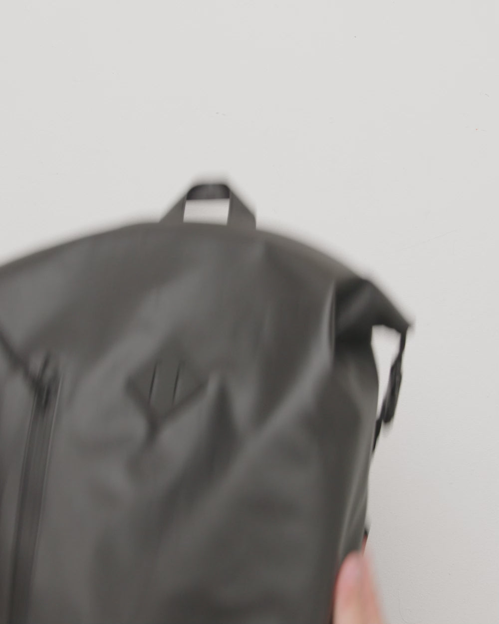 Herschel Supply Co. Weather Resistant Roll Top Backpack showcasing a detailed view of its clean, minimalist design and fabric texture.