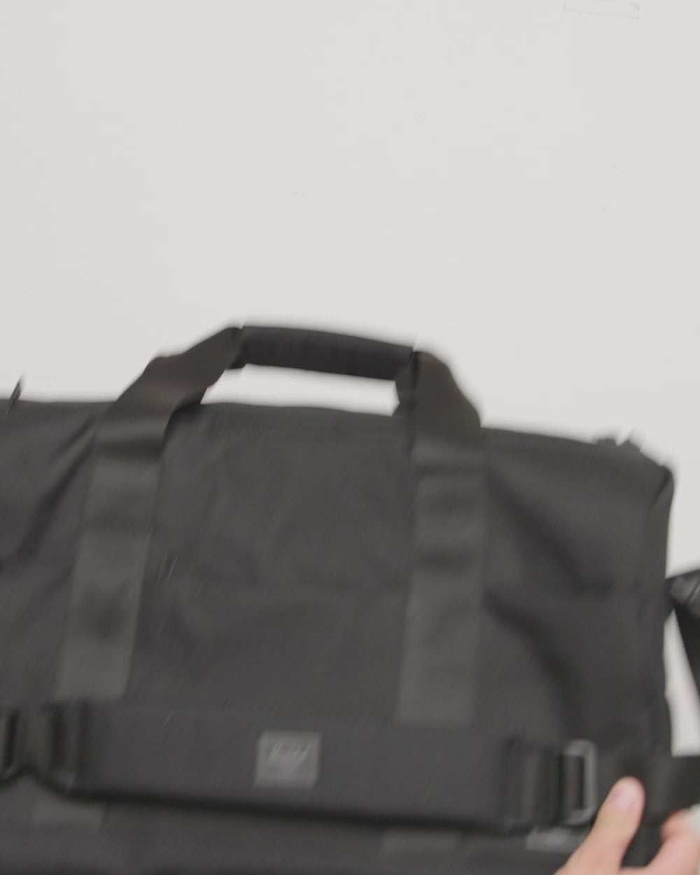Herschel Supply Co. Novel Duffle Tech bag displayed in a rotating video frame showing all colors.