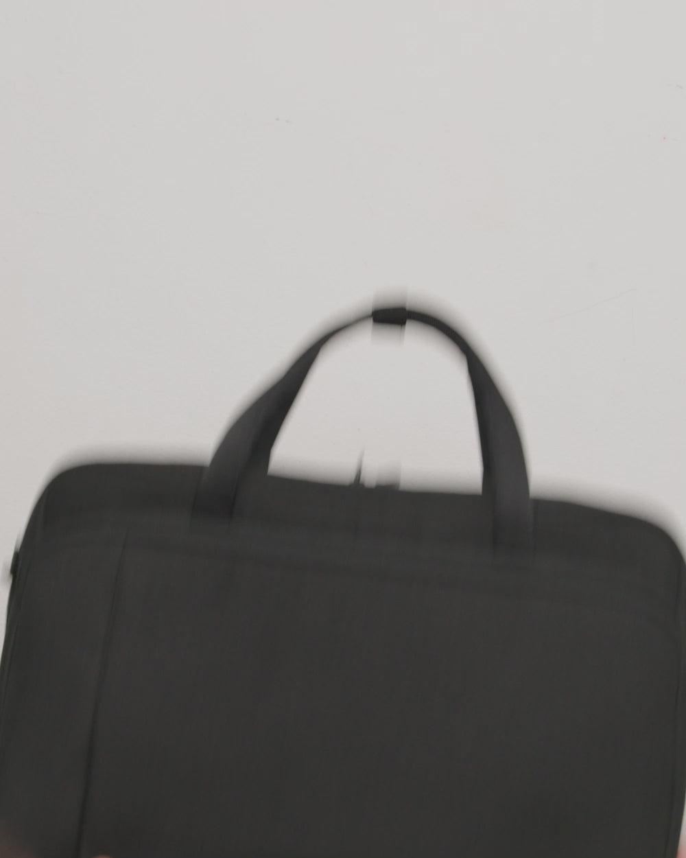 Herschel Supply Co. Gibson Messenger Tech bag in a multi-color block design featuring two main compartments, top handles, and a shoulder strap.