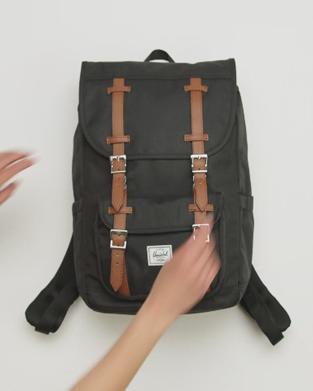 Video showcasing the Herschel Supply Co. Little America Mid Backpack available in various colors.